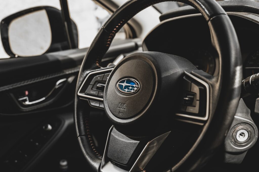 a close up of a steering wheel and dashboard of a car