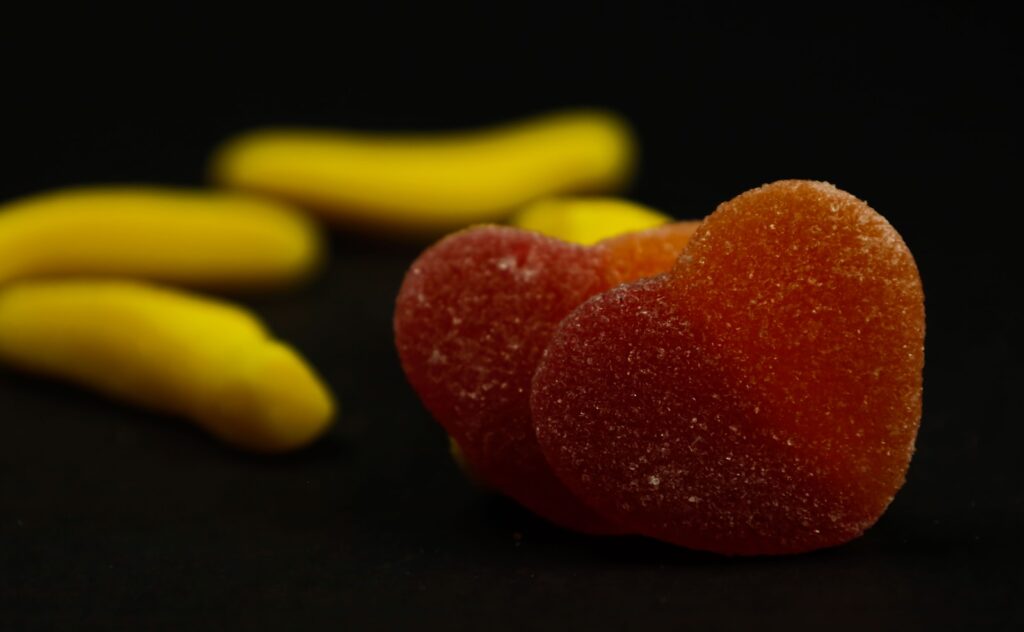 a couple of pieces of fruit sitting on top of a table