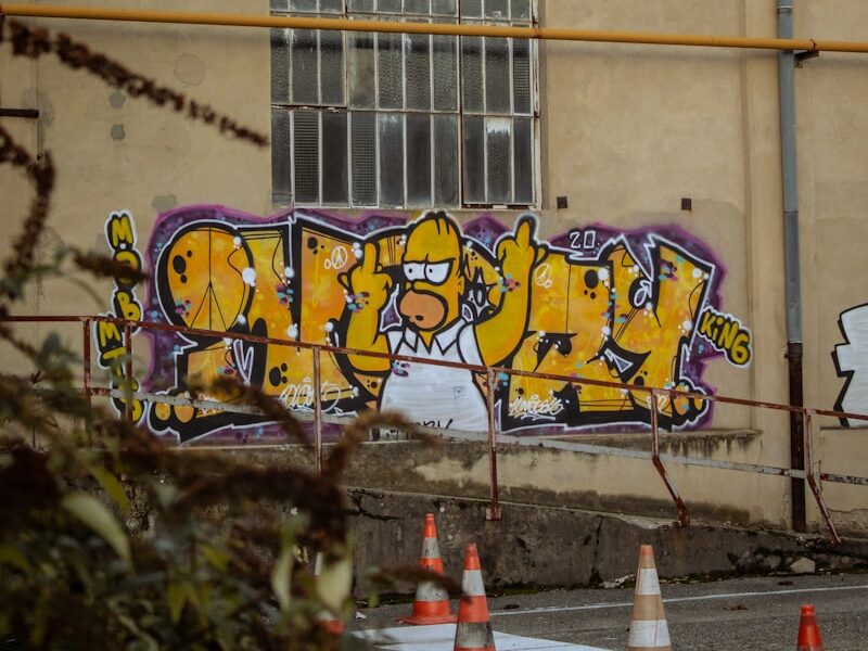 yellow and black graffiti on wall