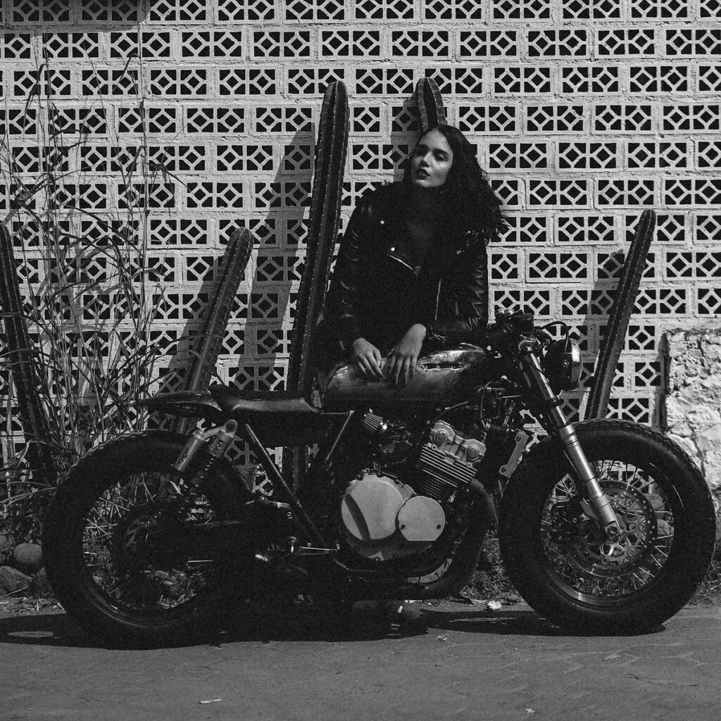 woman in black jacket riding motorcycle
