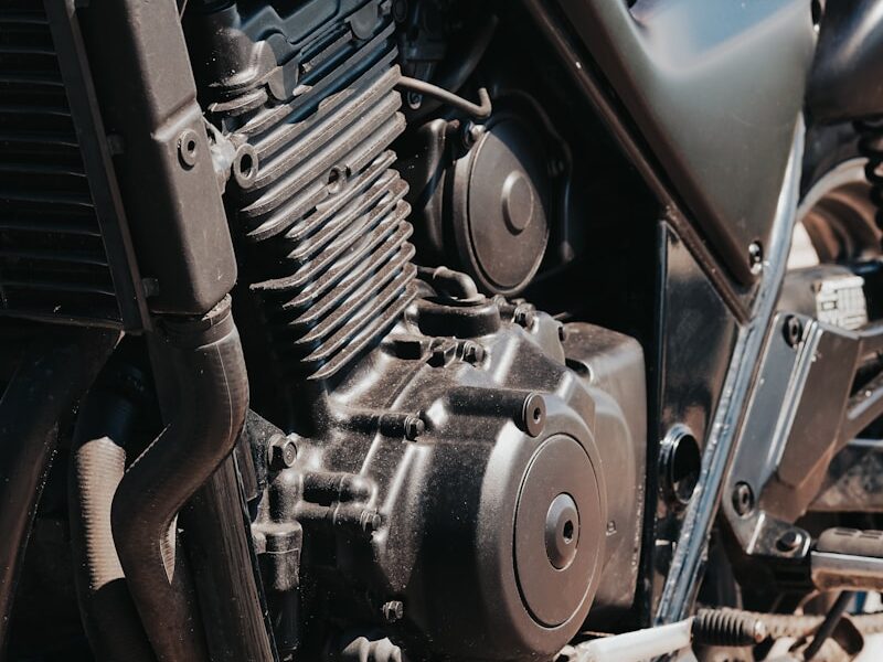 a close up of a motorcycle parked in a parking lot