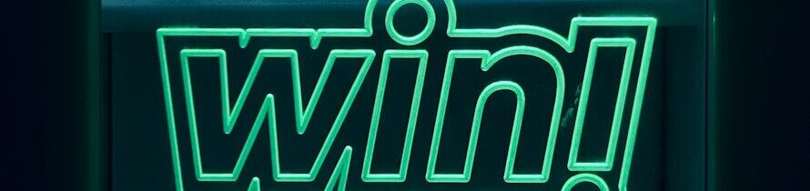 a neon sign with the word win on it